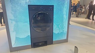 Midea WashBot combination robot vacuum / washing machine being demoed at IFA